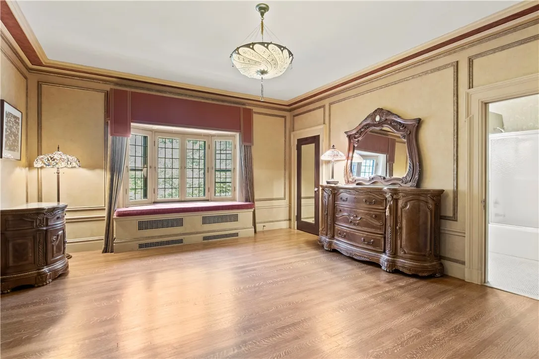 A seven room primary suite begins with a masterful window seat.
