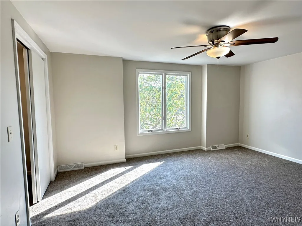 The primary bedroom has new carpeting