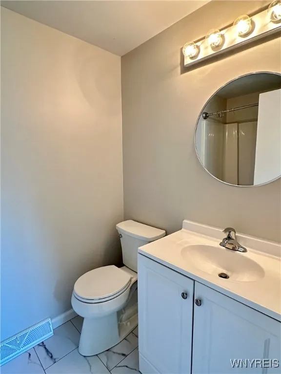 The master bath has new flooring, toilet & vanity