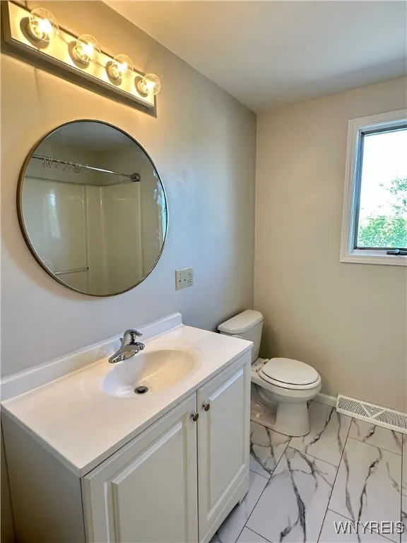 2nd full  bath on the 2nd floor has new flooring & vanity.