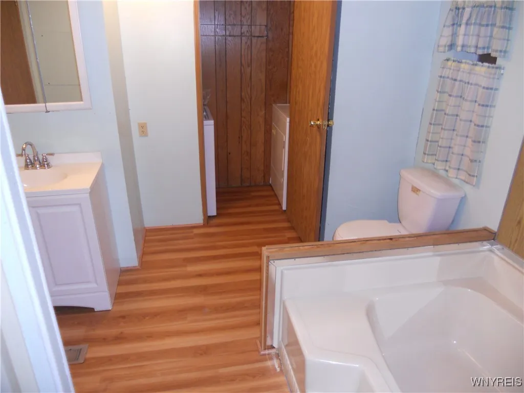 laundry room in back of bathroom