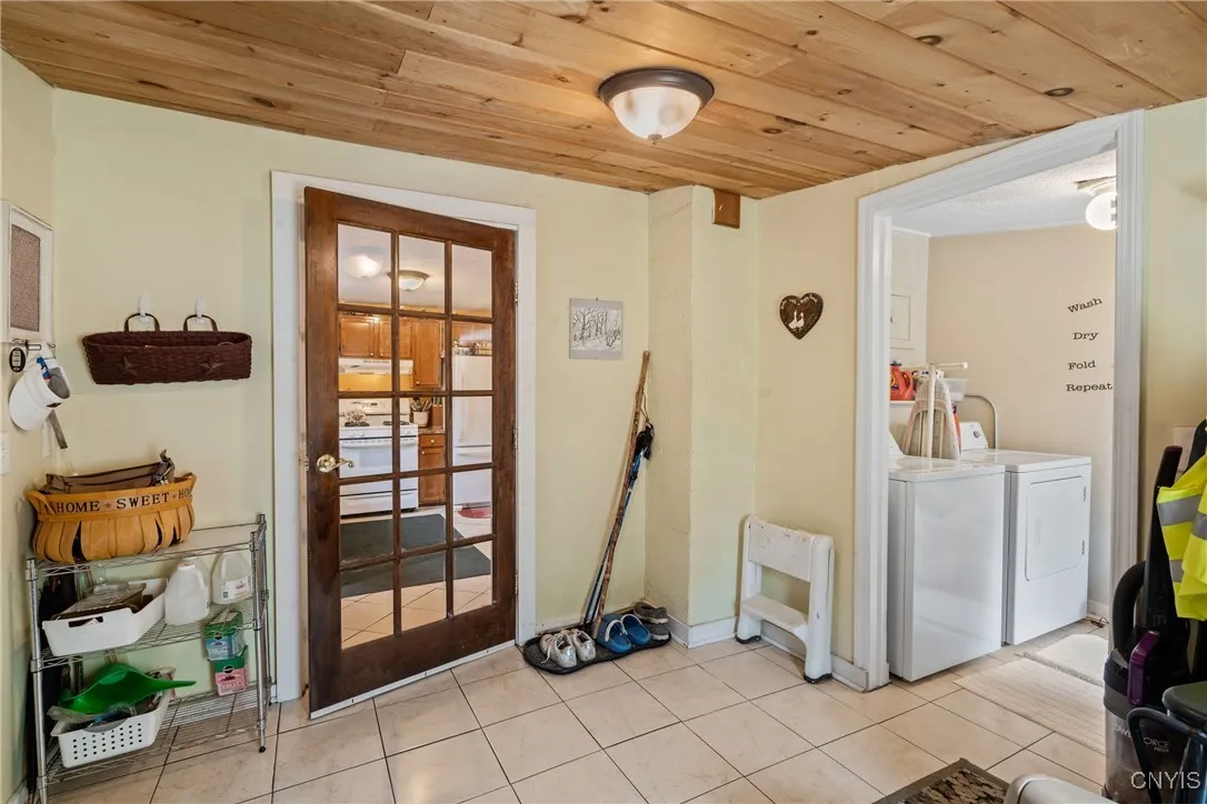 Mudroom looking to laundry and kitchen