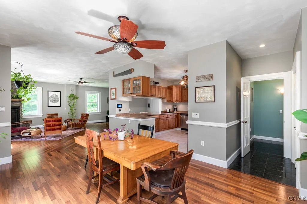 Here’s another wide view of the first floor—take note of the back hall, which leads to a spacious kitchen pantry and a generous half bathroom. Thoughtful layout and convenience throughout!