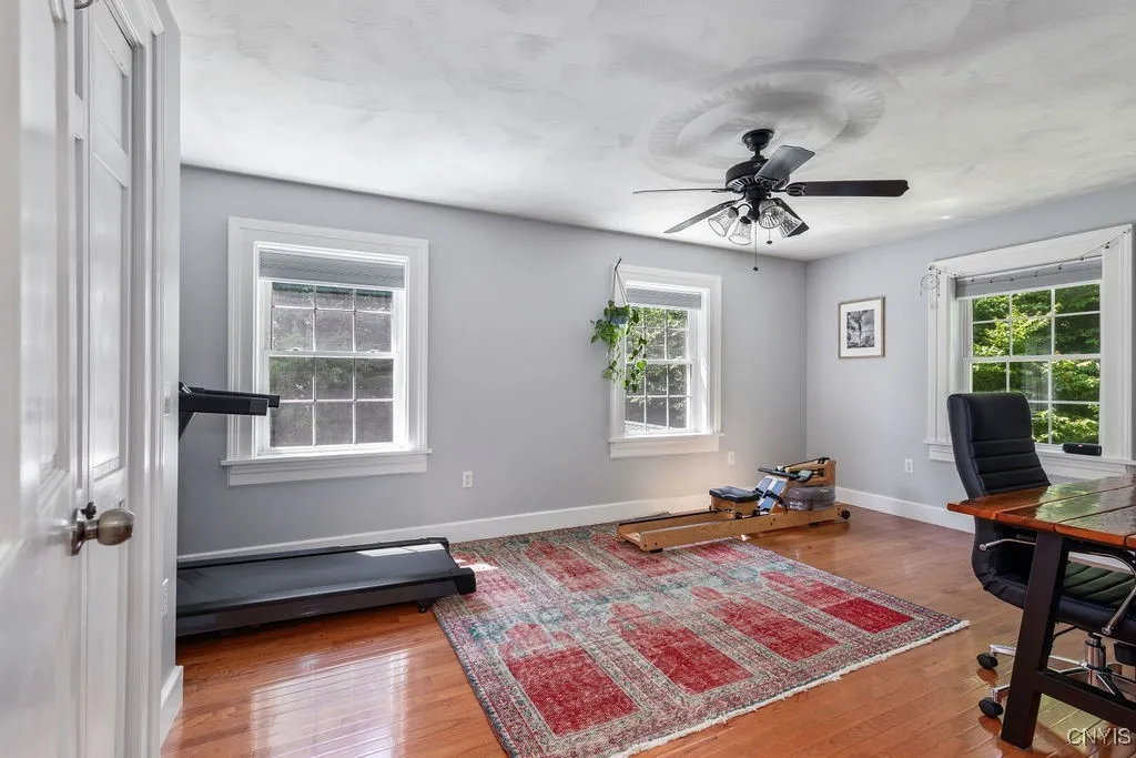 Bedroom #2 is huge, with a generous closet and plenty of windows. The home’s privacy and tight insulation mean you won’t need window coverings—it stays comfortable year-round. Plus, oak flooring runs throughout the entire second floor.





