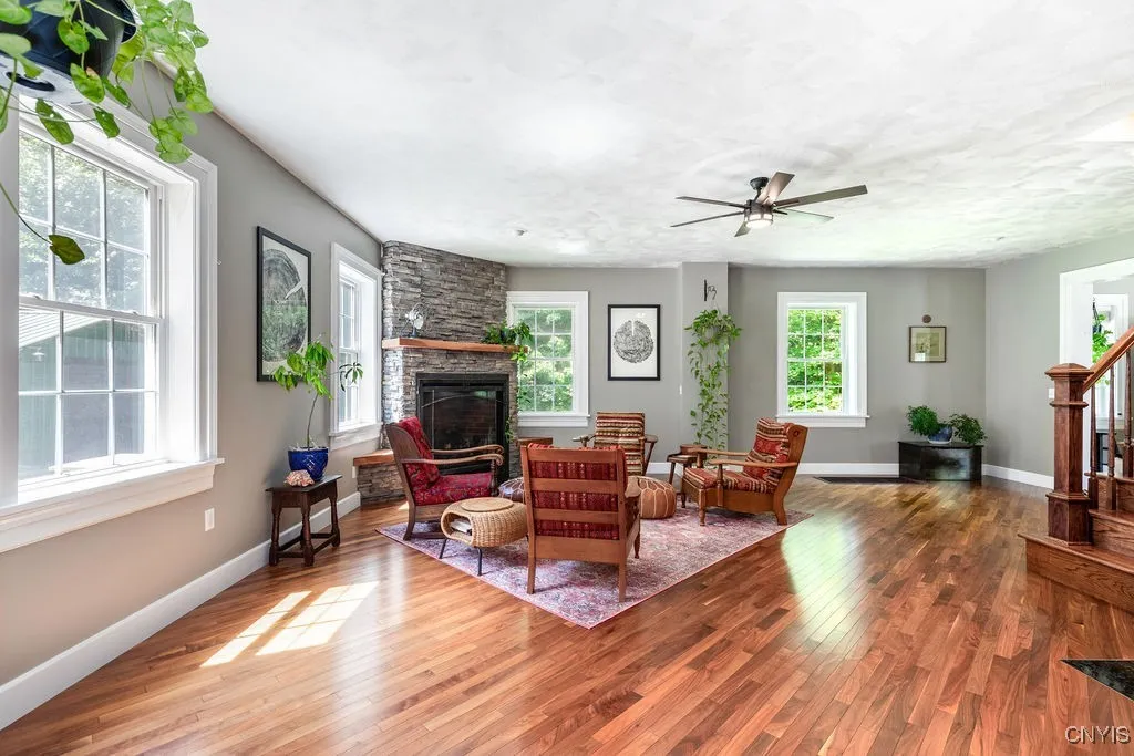 The interior finishes in this home are truly beautiful—featuring heavy trim around all openings and large white baseboards that perfectly highlight the rich walnut floors.





