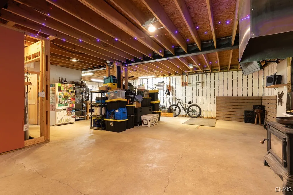 As described, the walk-out basement features impressive 8'6" ceilings and 8" thick poured concrete walls reinforced with over 4,000 feet of rebar. With vinyl studding every 8 feet and 2¼ inches of foam insulation on both sides of the concrete, the basement walls achieve an incredible R-50 insulation value—making it perfect for future finishing!