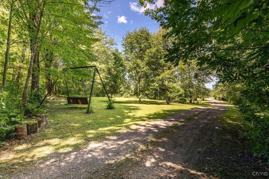 A park-like yard where kids can run and play all day—and even learn to ride their bike right on the driveway leading to your home!