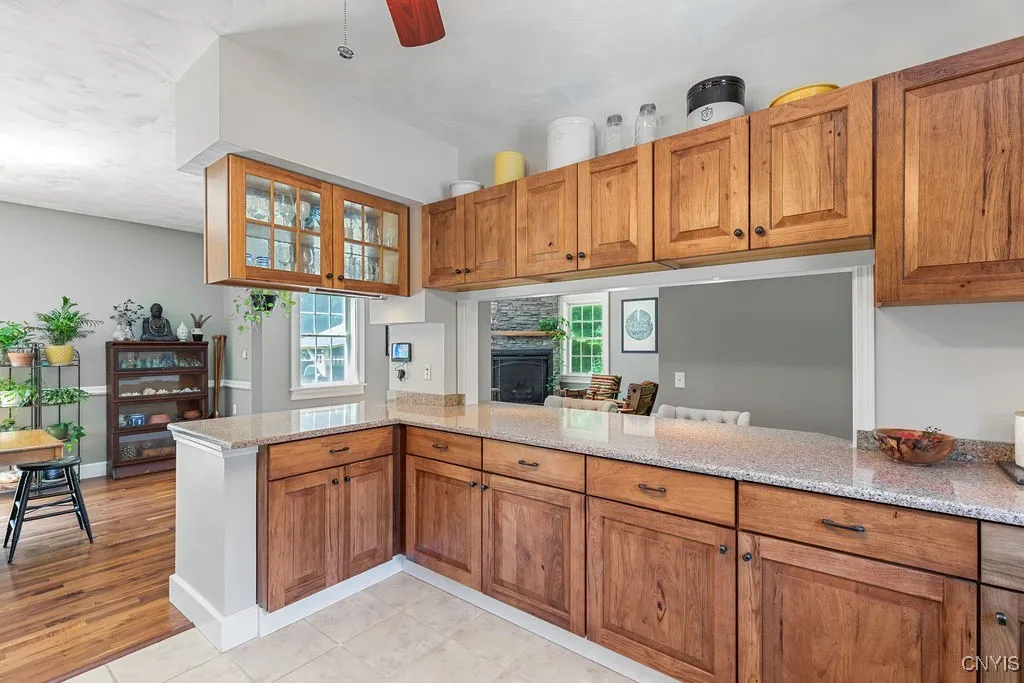 This kitchen offers tons of storage, with clear sightlines that let you see everything from one central spot. Don’t miss the custom glass cabinets—perfect for displaying your family treasures!





