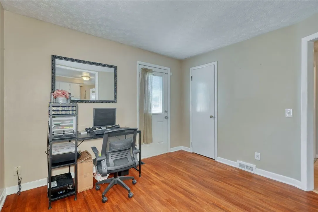 First floor office with door to rear yard - was 4th bedroom, can be converted back by adding one wall