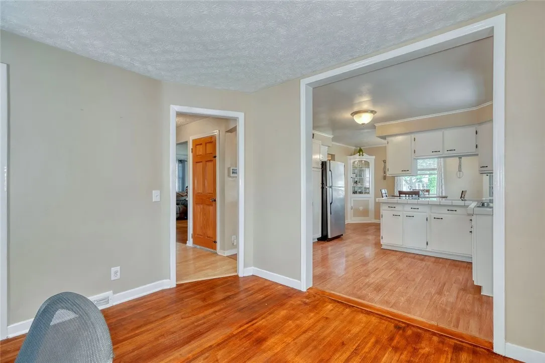 Wall between office and kitchen was removed to make office / dining room