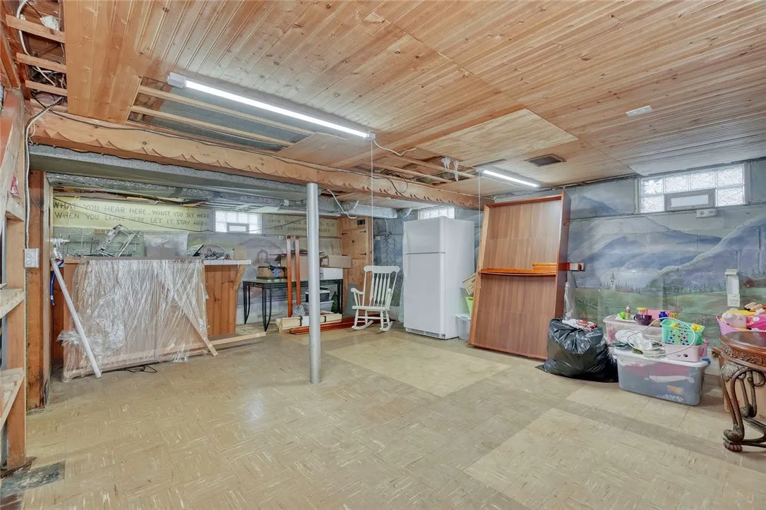 Partially finished basement with built in bar