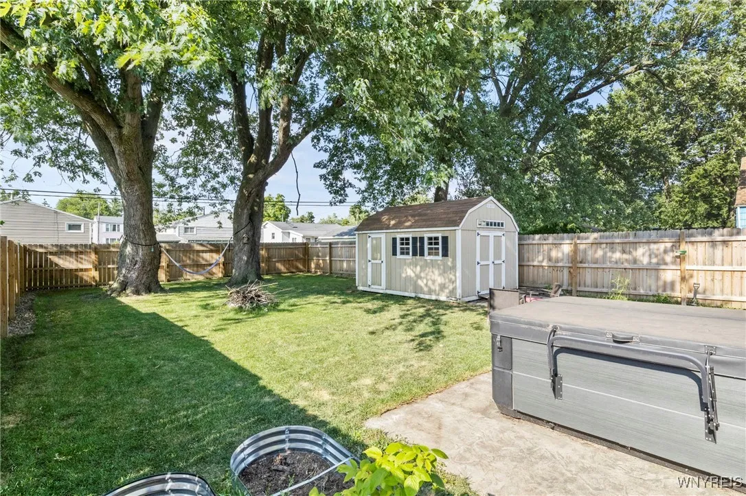 two mature trees in the yard make for the perfect oasis