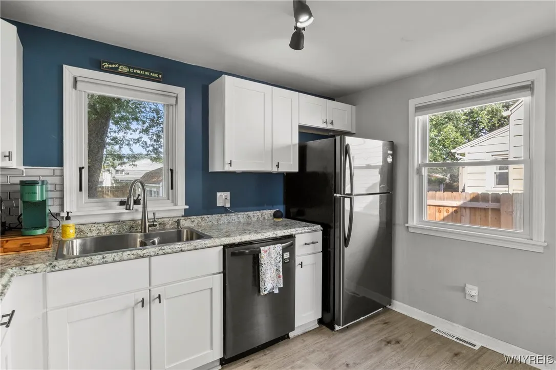 modern kitchen with a dishwasher and garbage disposal