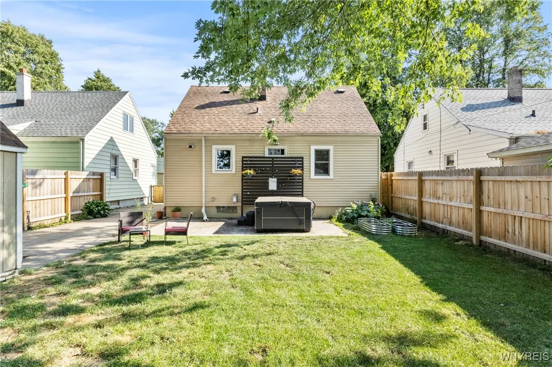 backyard featuring included hot tub