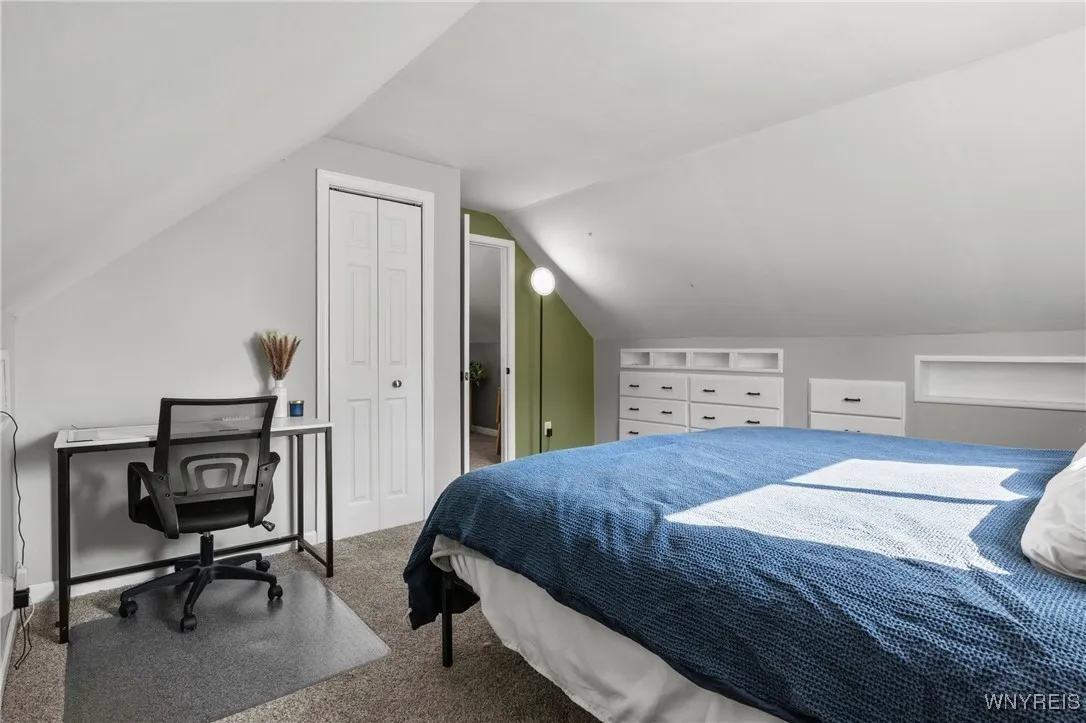 upstairs bedroom 3 with closet and built in storage