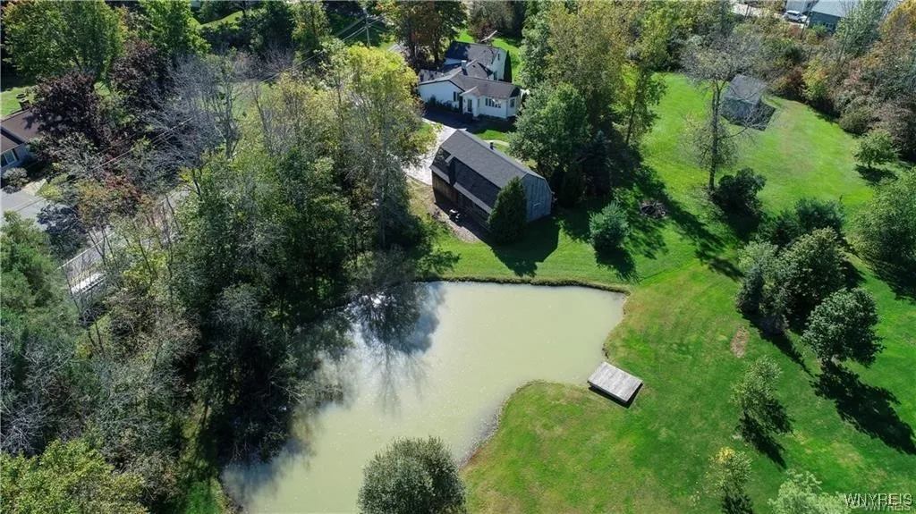 Aerial View of the Home and Pond from the Backyard