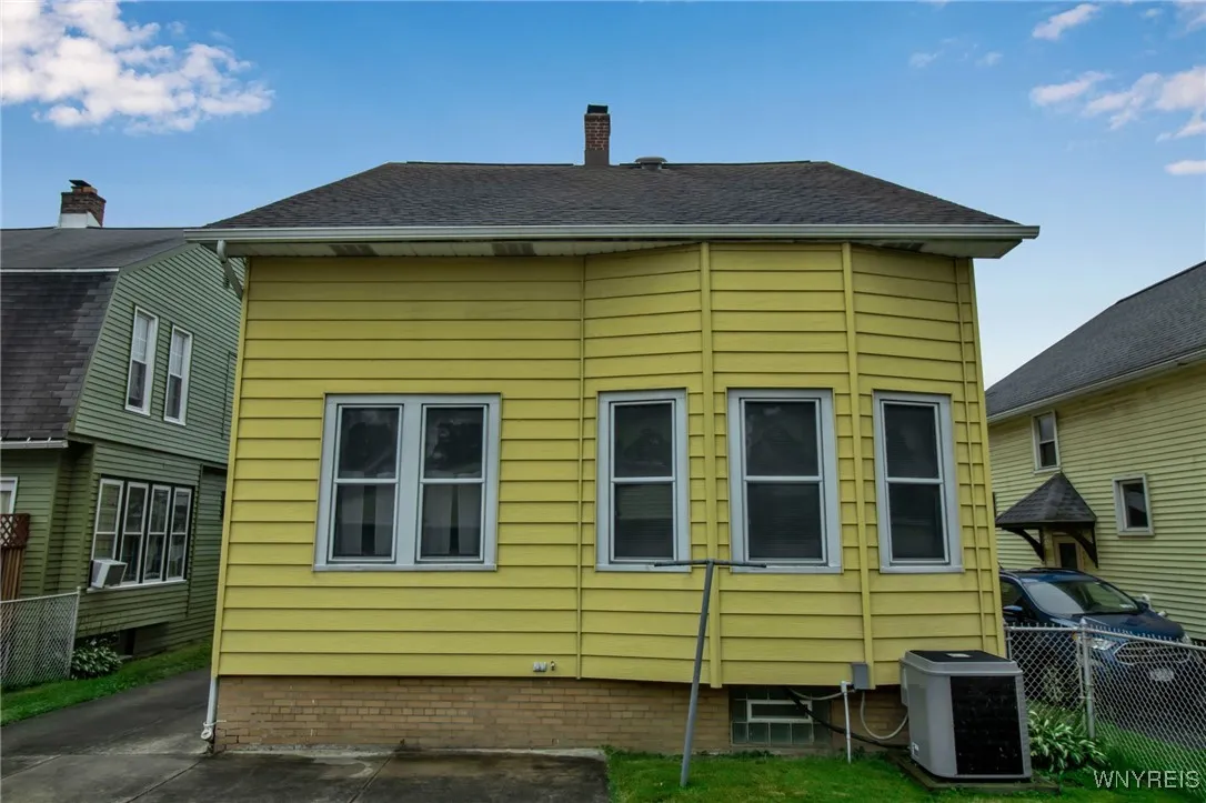 Back of Home with View of A/C Unit
