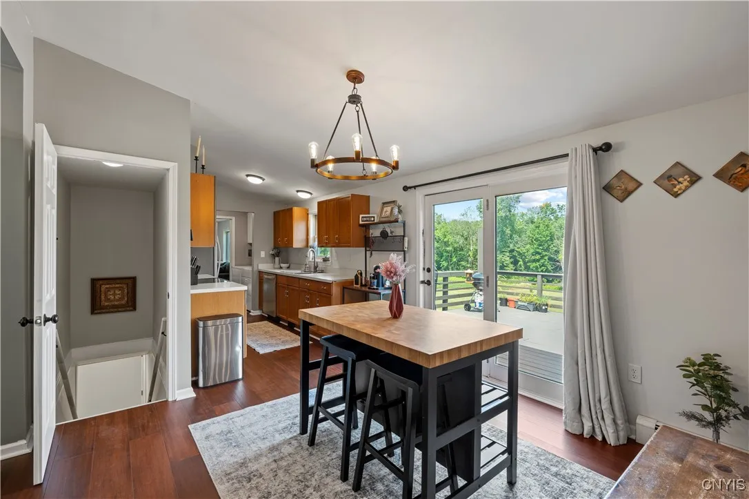 View of eat-in kitchen and basement entry