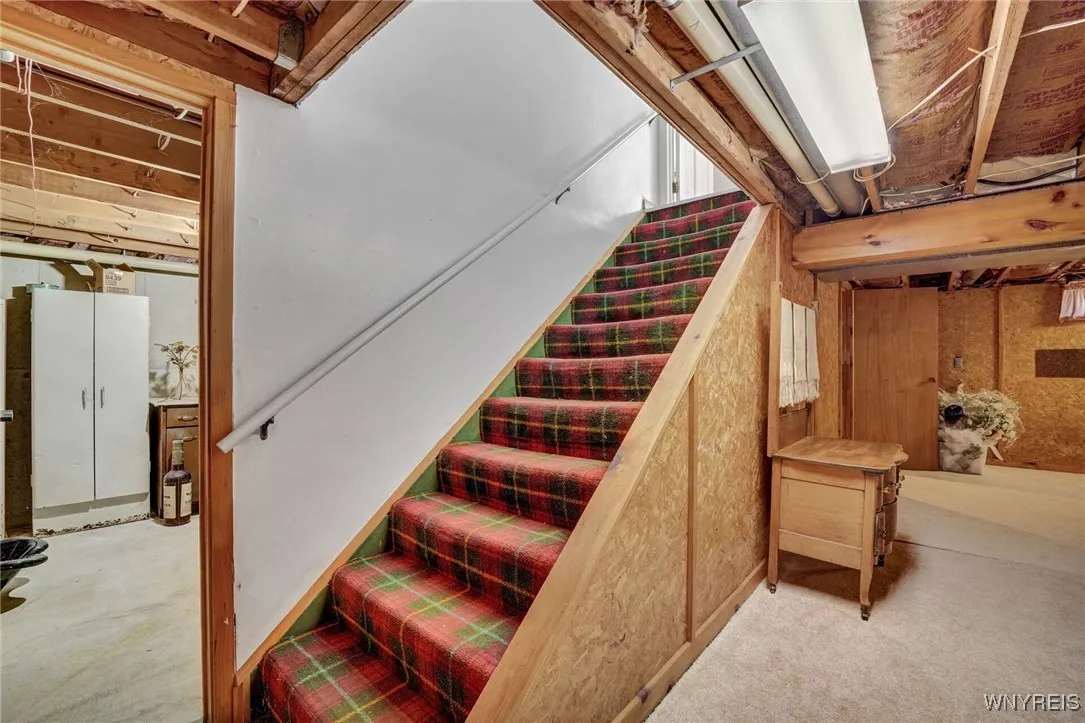GENEROUS STORAGE AREAS ON EACH SIDE OF BASEMENT