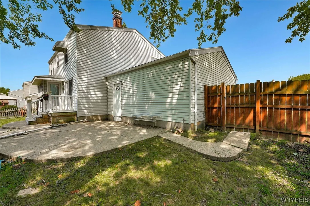 SMALL DECK OFF SLIDING DOOR OFF FAMILY RM PLUS CONCRETE PATIO