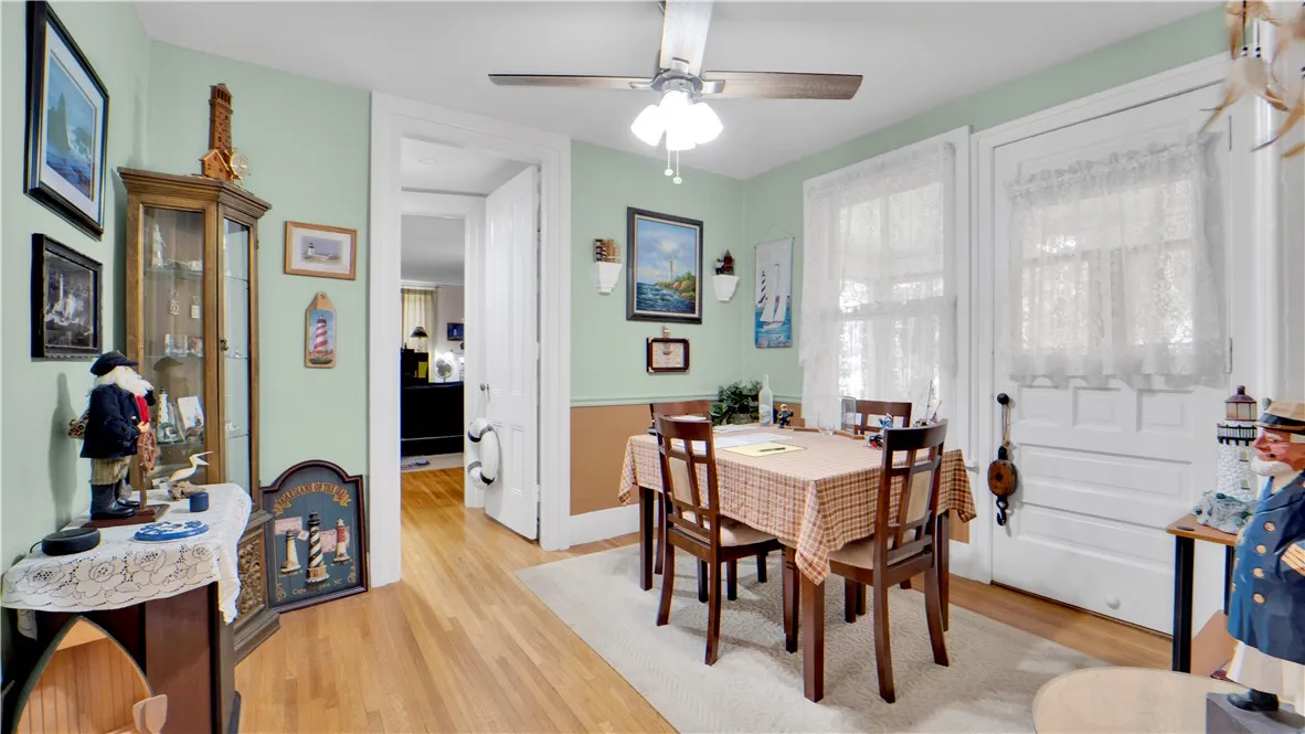 Dining Room off of Kitchen and Living Room and door opens to Quaint 3 Season Room