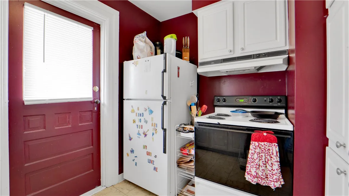 Kitchen with outside area for upper unit