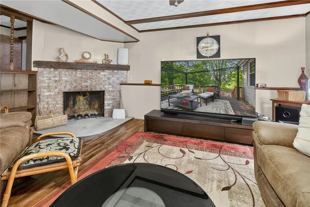 The downstairs family room with a wood burning fireplace