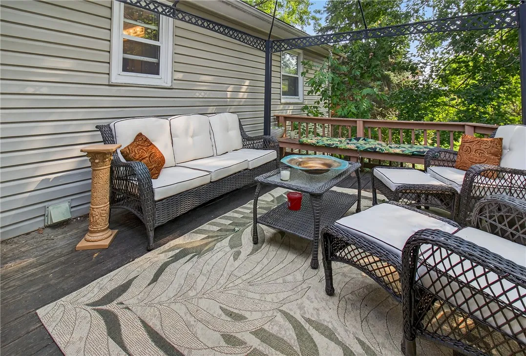 The back deck off the enclosed porch is a serene place to relax and unwind