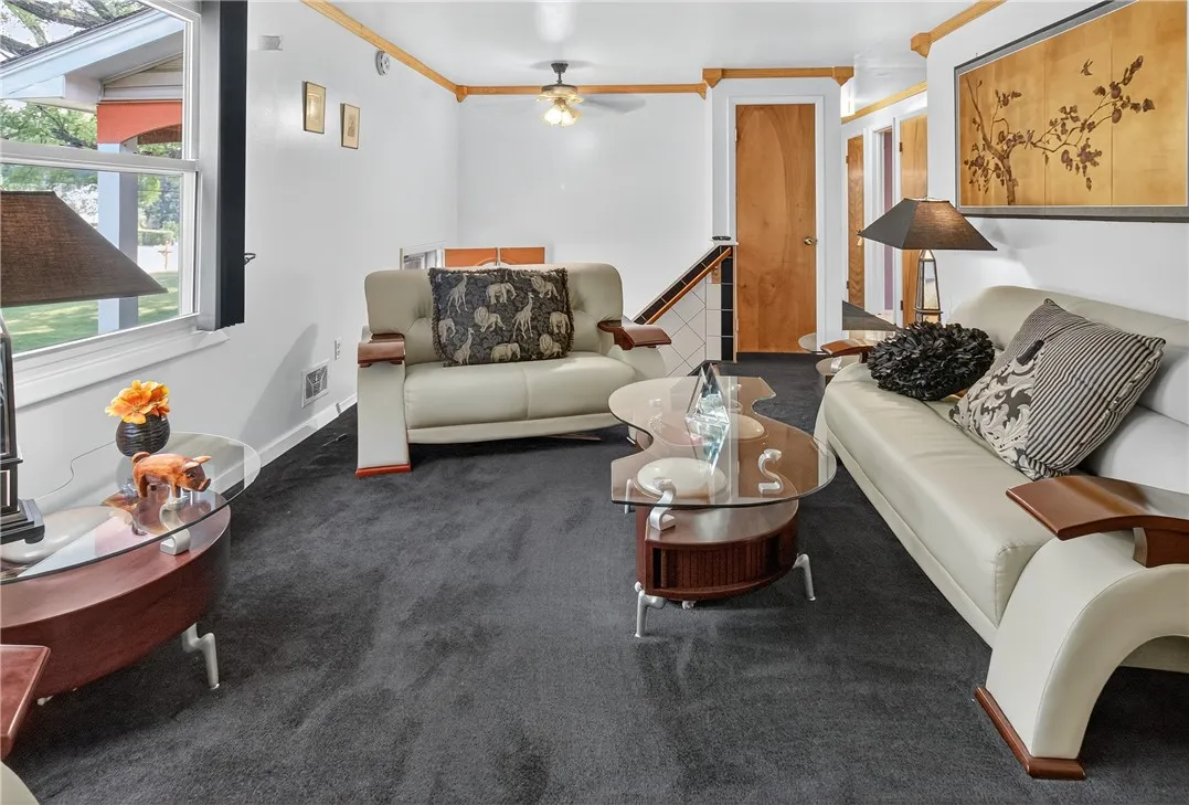 The bright living room leads to the kitchen