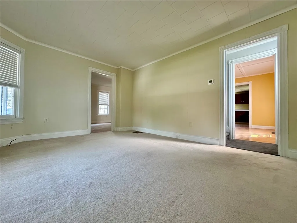 Formal living room looking into dining room