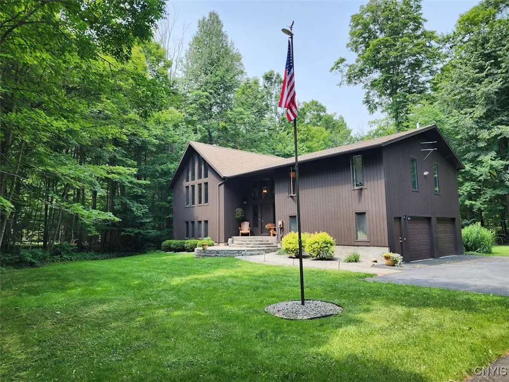 The home is perfectly nestled on its spacious lot of over an acre.