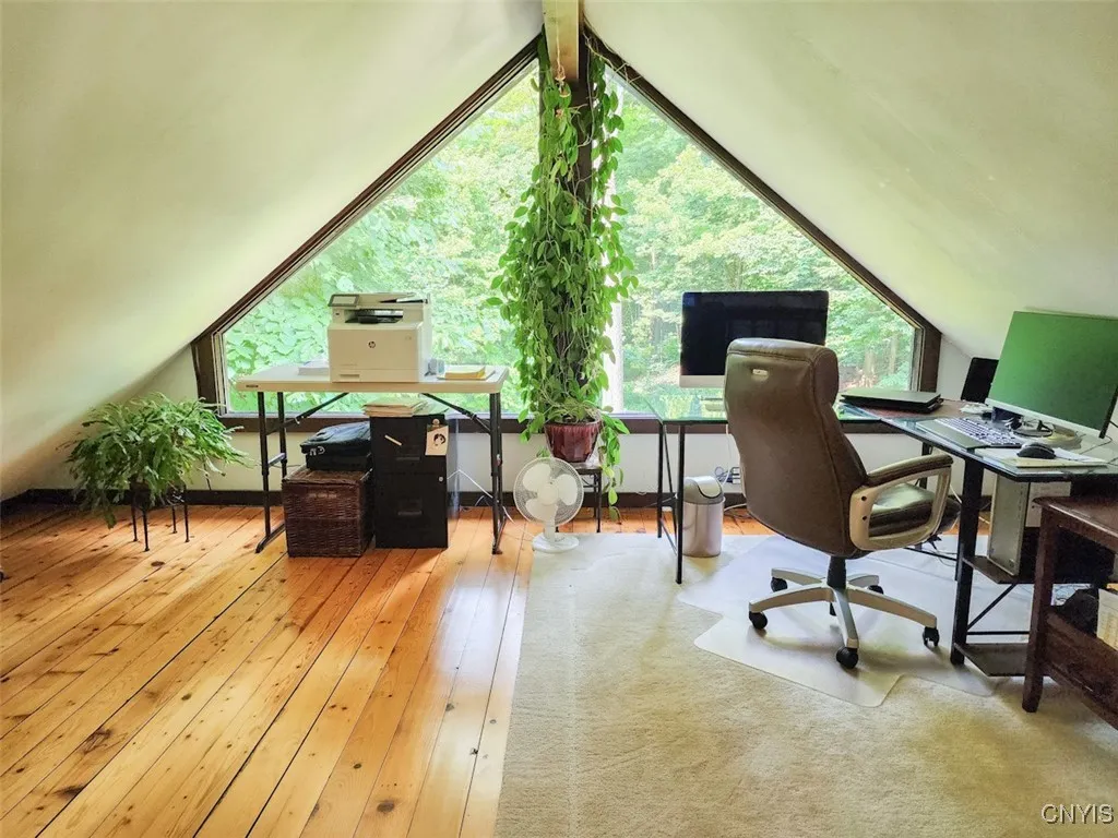 There is a wonderful bonus loft! This is currently being used as a home office- how calming and private.
