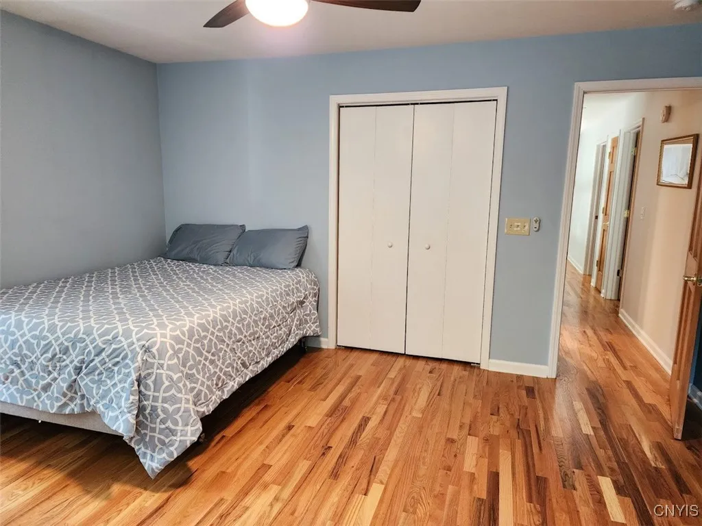 The third bedroom upstairs has lots of space, gorgeous hardwoods and wonderful natural light.