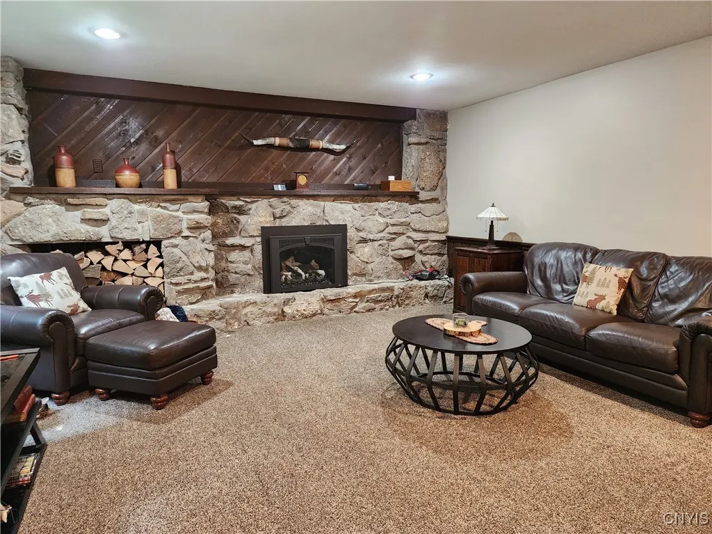 You'll love the eye-catching stone fireplace, with plenty of space to showcase your favorite pieces.