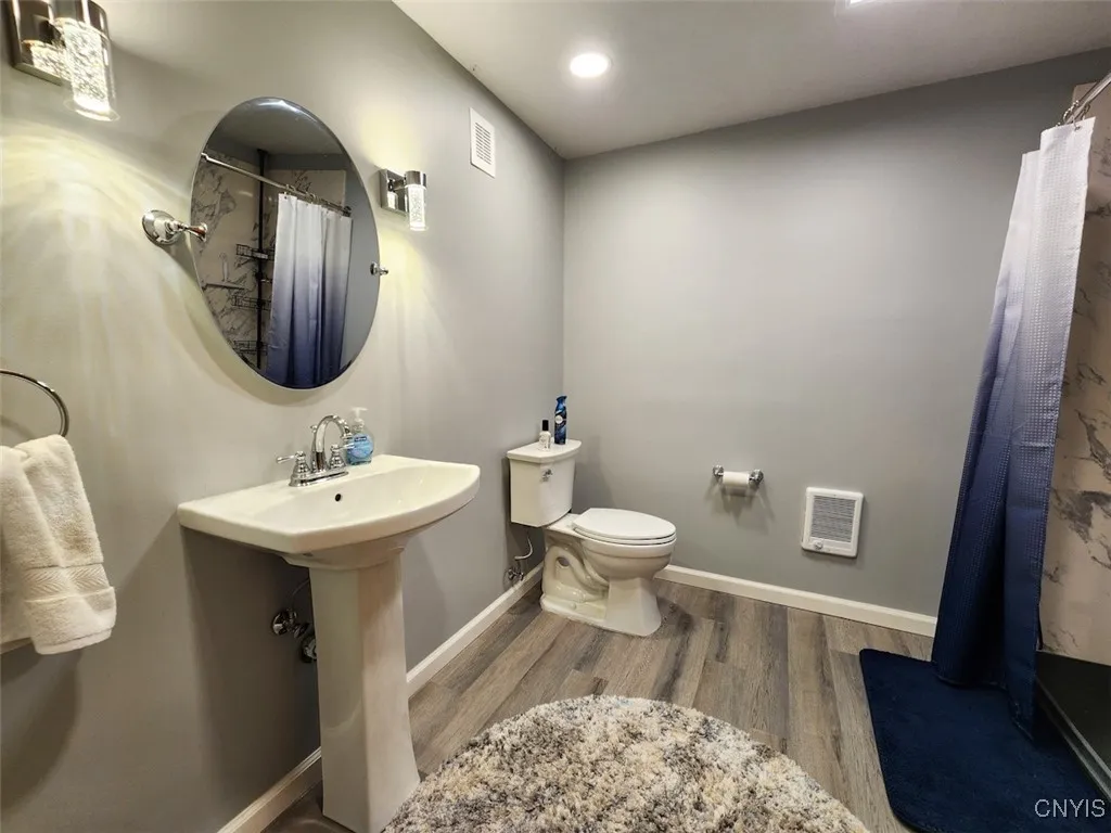 The spacious downstairs full bath has been completely renovated, how lovely!
