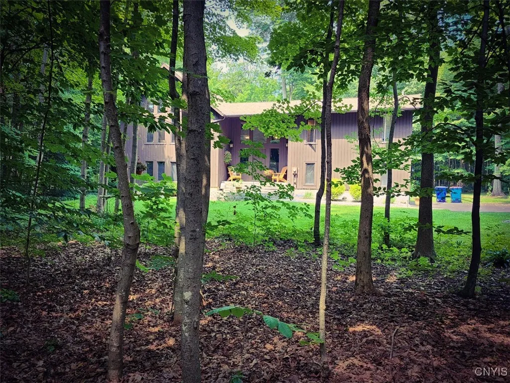 There is a lovely wooded area in the front of the home offering incredible privacy as well as natural beauty...