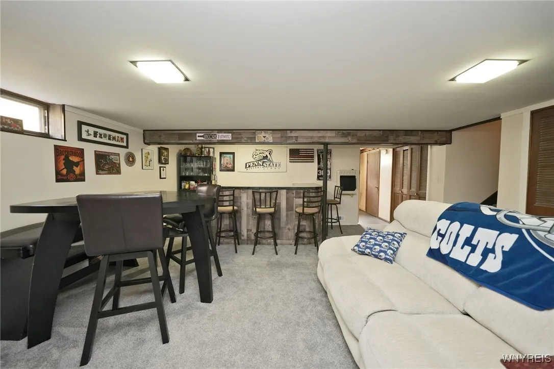 Partially finished basement w/ bar