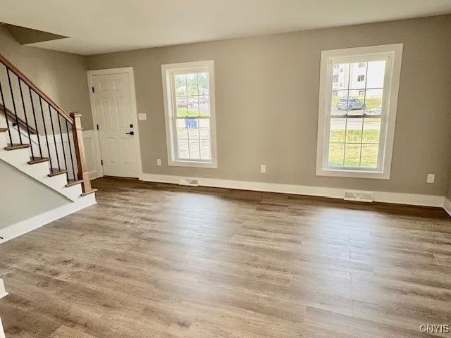 Spacious living room w/ NEW flooring