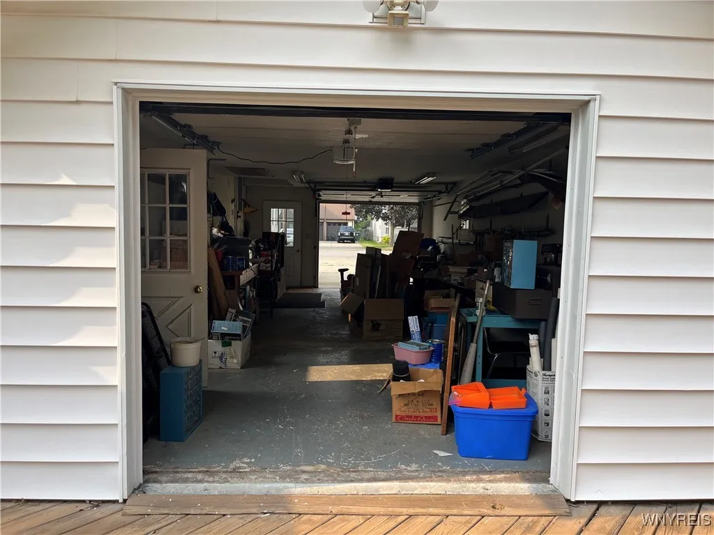 Attached garage has a back garage door for easy access