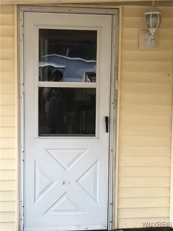 UP-DATED STORM DOOR