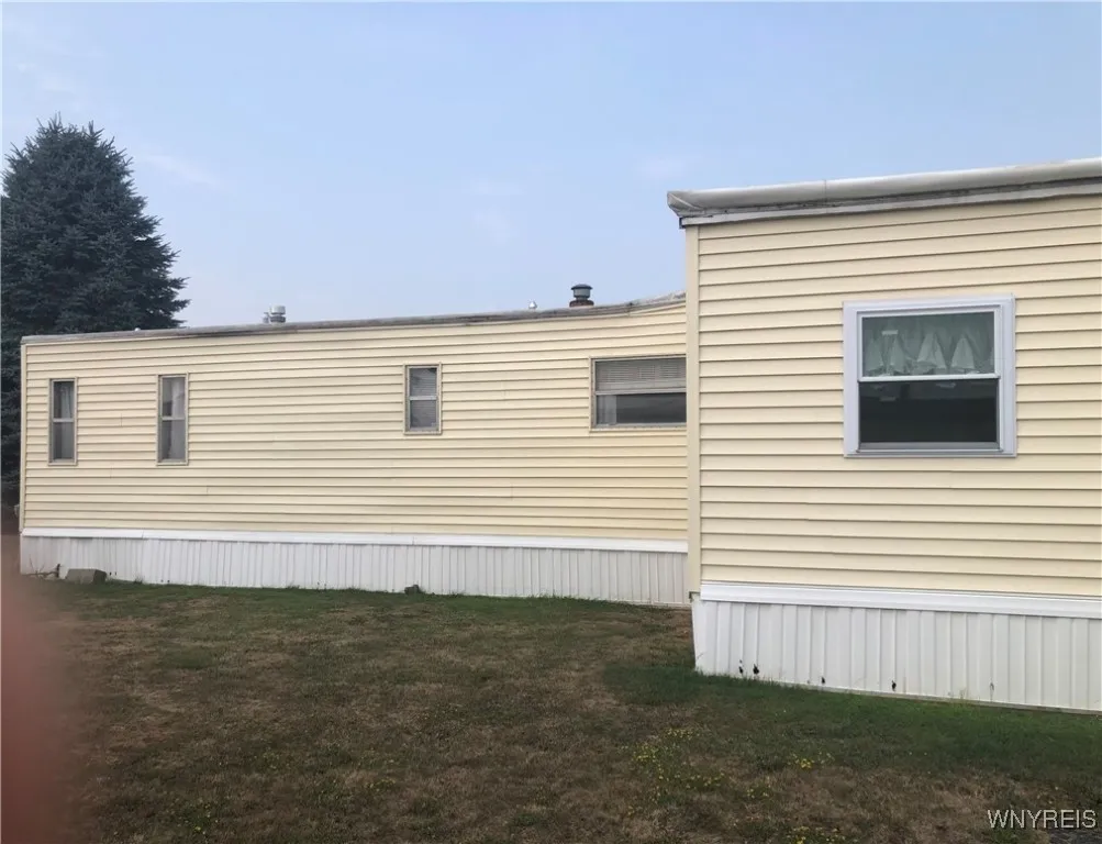 EAST SIDE OF DWELLING