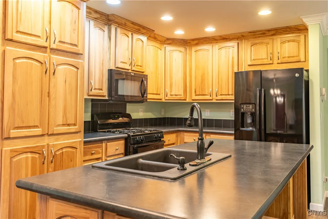 LOTS OF MAPLE CABINETS, ALL THE MODERN APPLIANCES AS WELL.