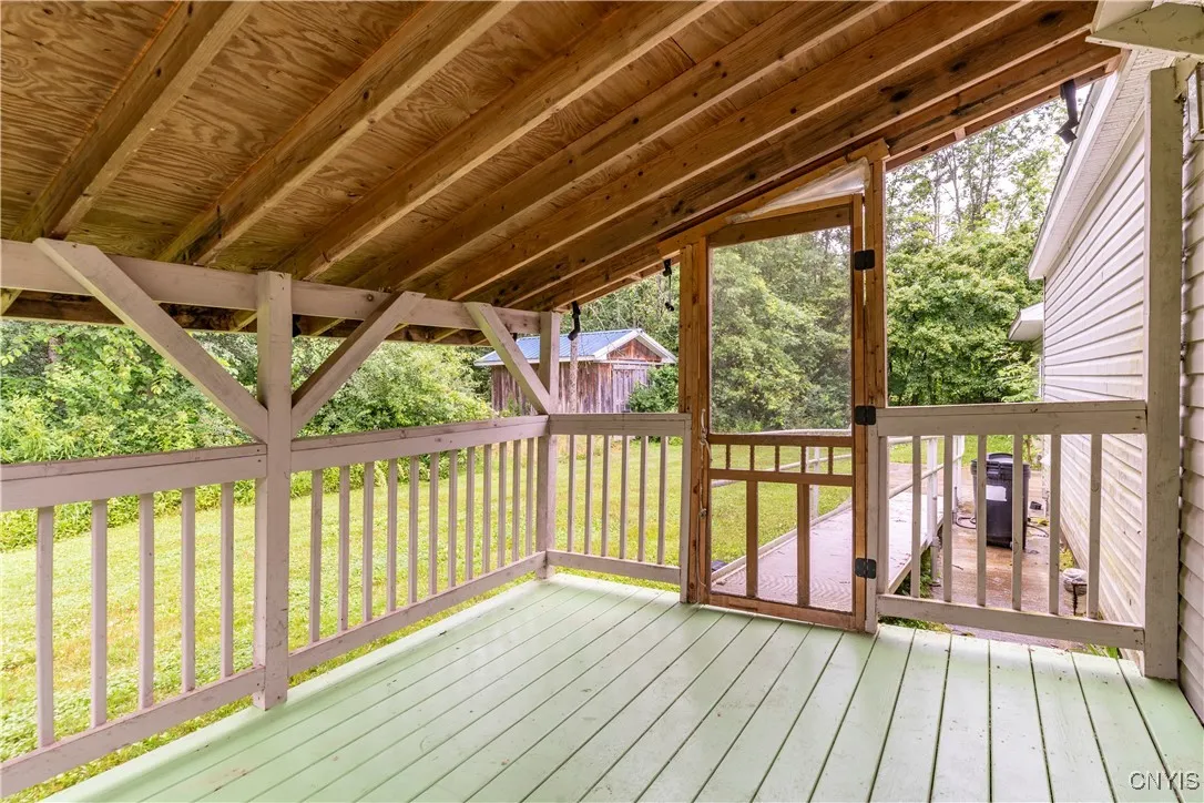 Enjoy the outdoors in comfort on the spacious back covered porch—perfect for morning coffee or evening unwinding.
