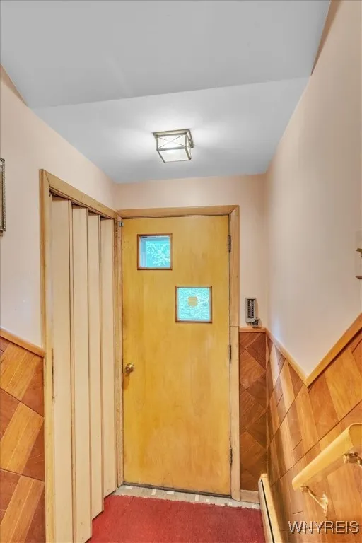 Solid rear door to gain entry to the back yard and a large closet off to the left