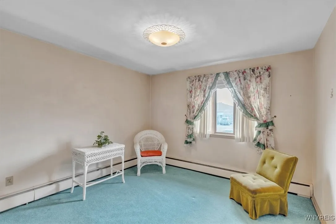 Second of four bedrooms, Baseboard heat provides even heating throughout the home.