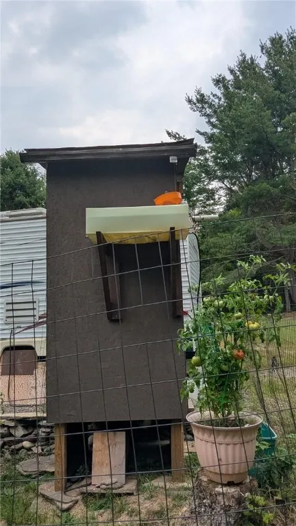 Rainwater collection system provides water for outhouse and flush toilet in camper