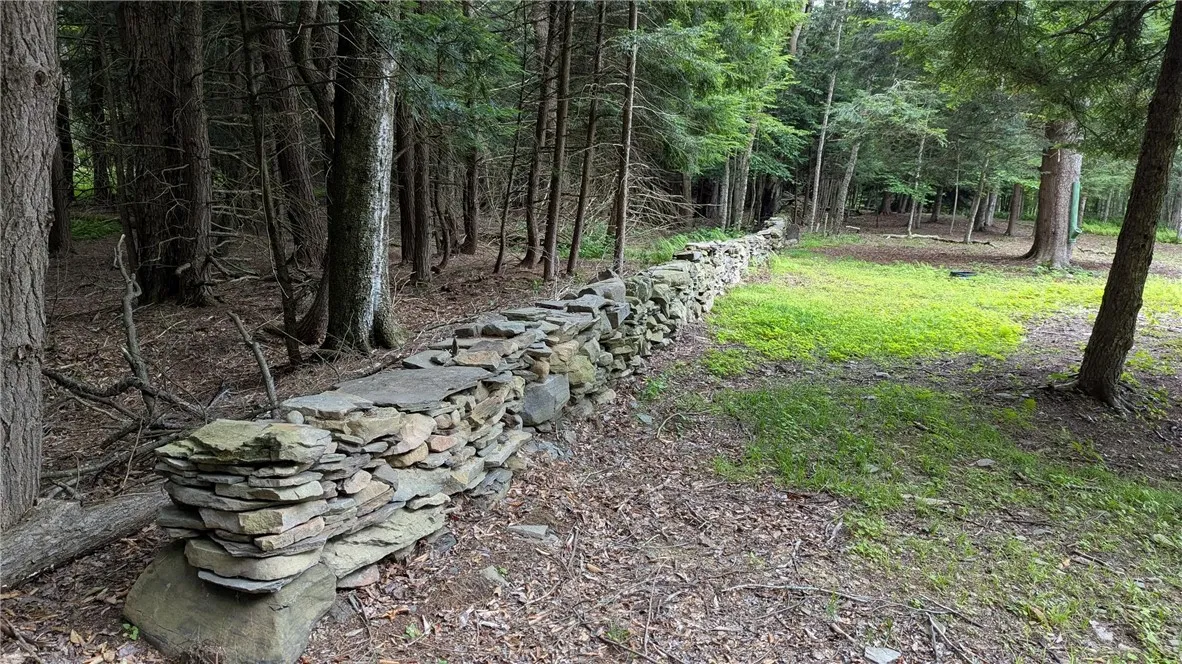 Stone walls add to the country charm of this parcel