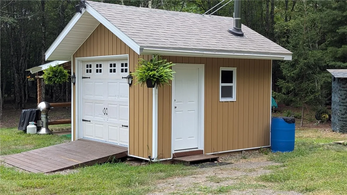 12X12 shed has sweet wood stove, 16X16 addition. One of two  Generators provides power that is available for purchase.