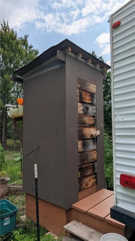 Outhouse with flush toilet