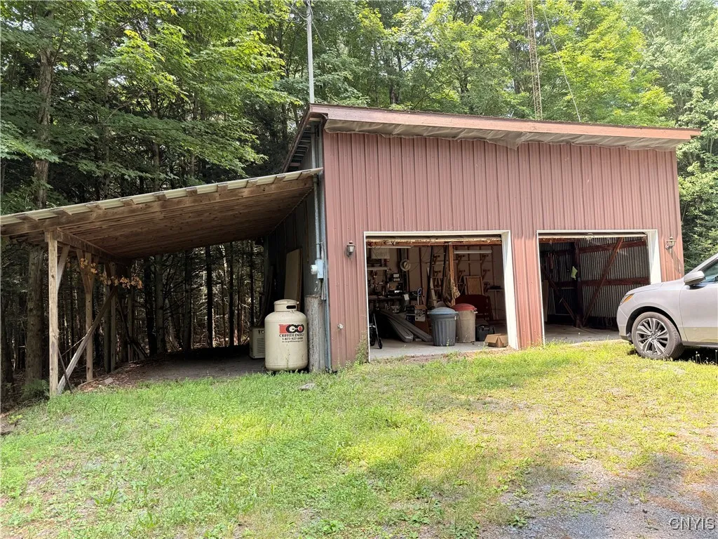 two stall garage and lean-to used for camper storage